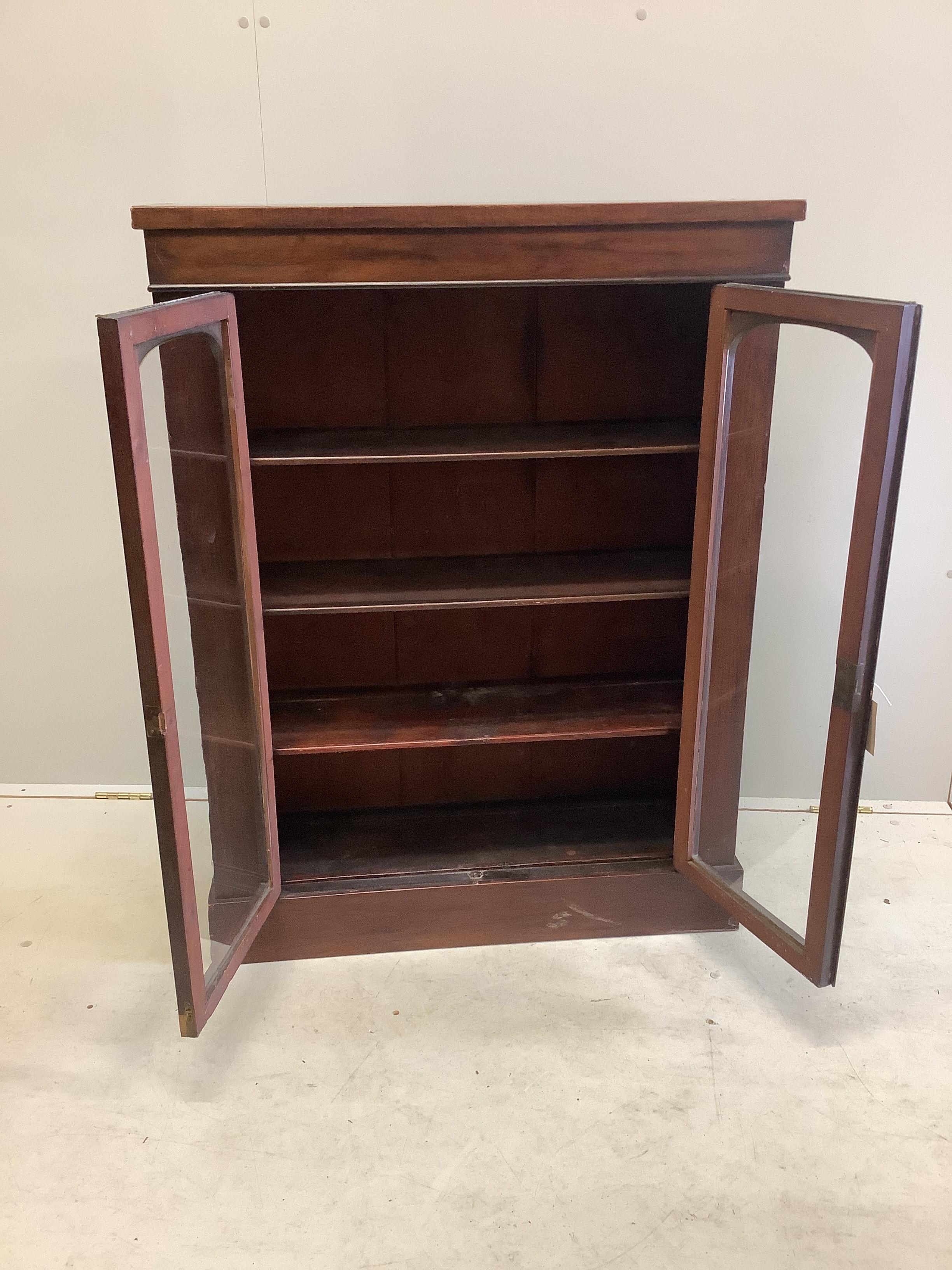 A late Victorian mahogany glazed bookcase, width 80cm, depth 29cm, height 106cm